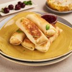 МЛИНЦІ З СОЛОДКИМ СИРОМ ТА РОДЗИНКАМИ